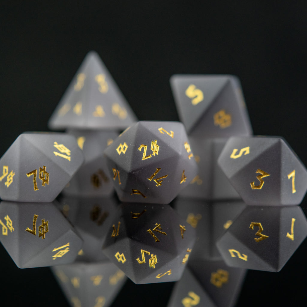Frosted grey cat's eye stone dice set with golden nordic font