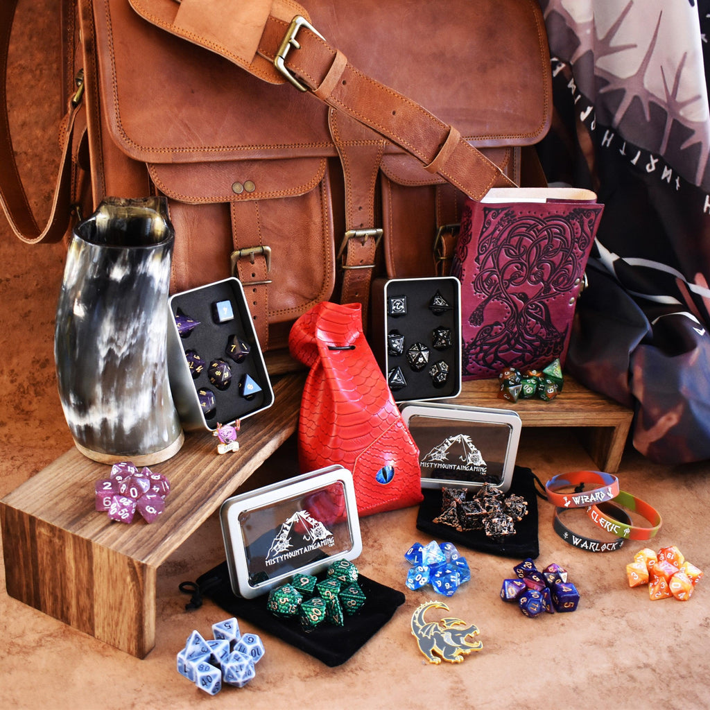 Leather laptop bag, dice sets, and other examples of items within the mystery bag bundle