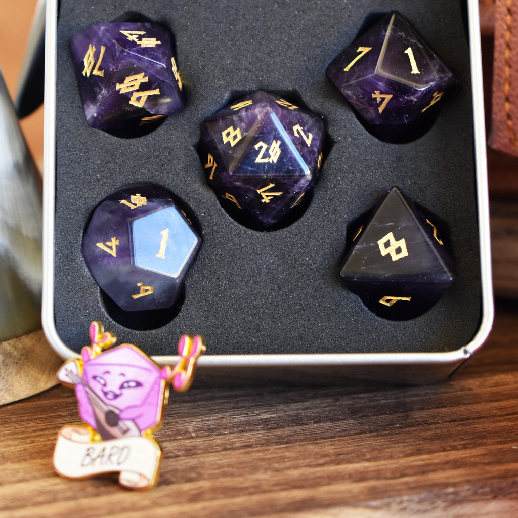 A stone dice set with pin