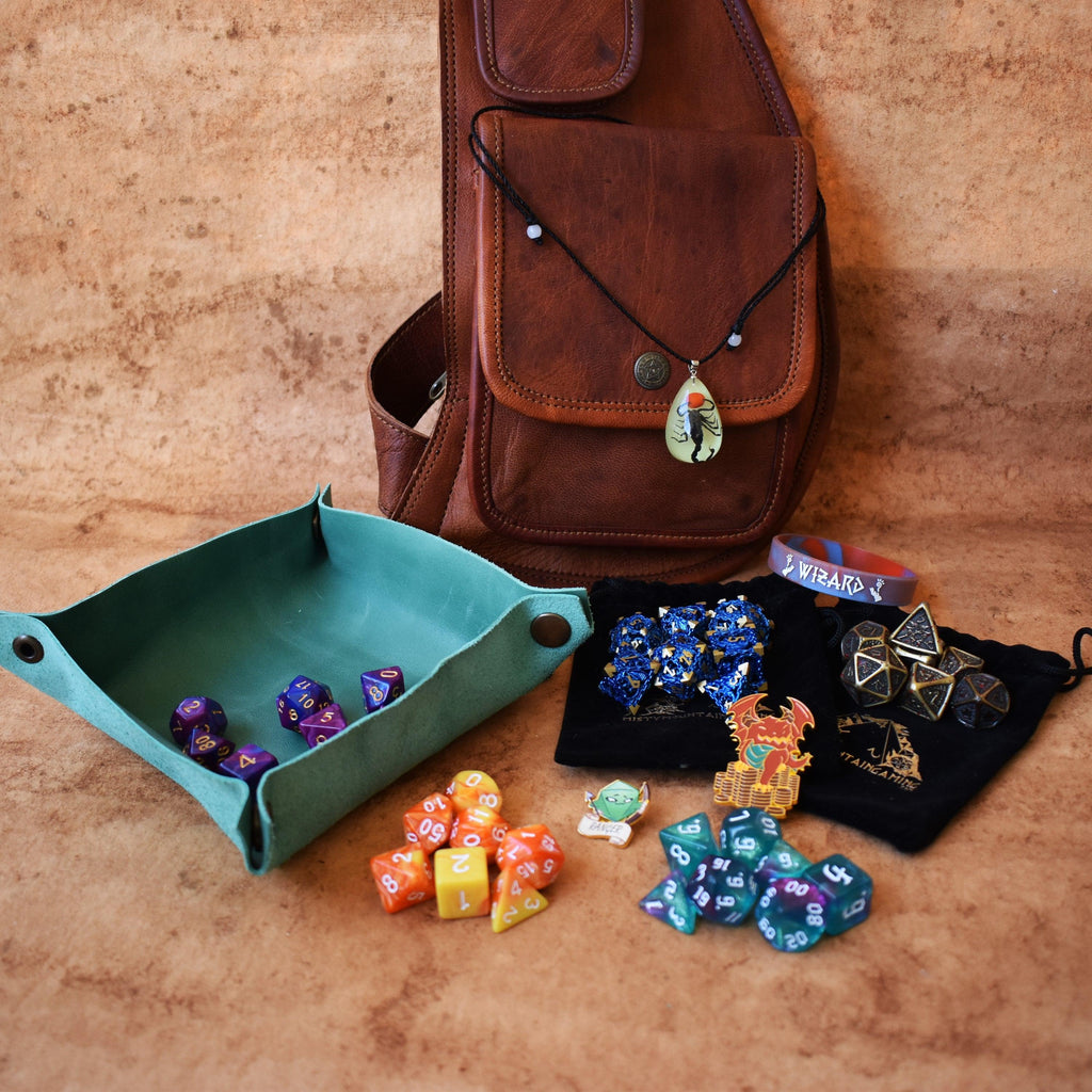 A brown leather sling mystery dice bag with examples of the items within