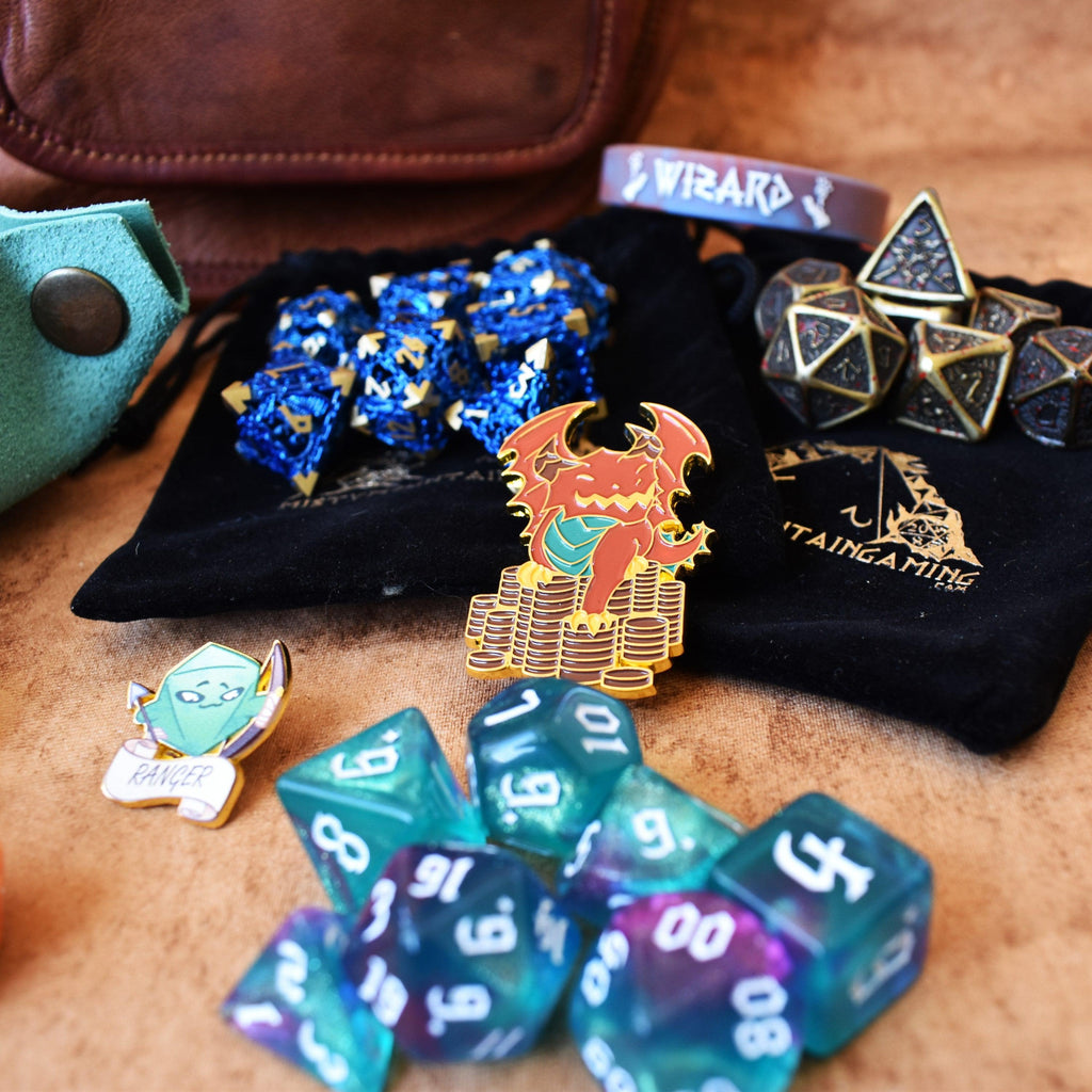 3 sets of dice and examples of other items within our mystery bundle