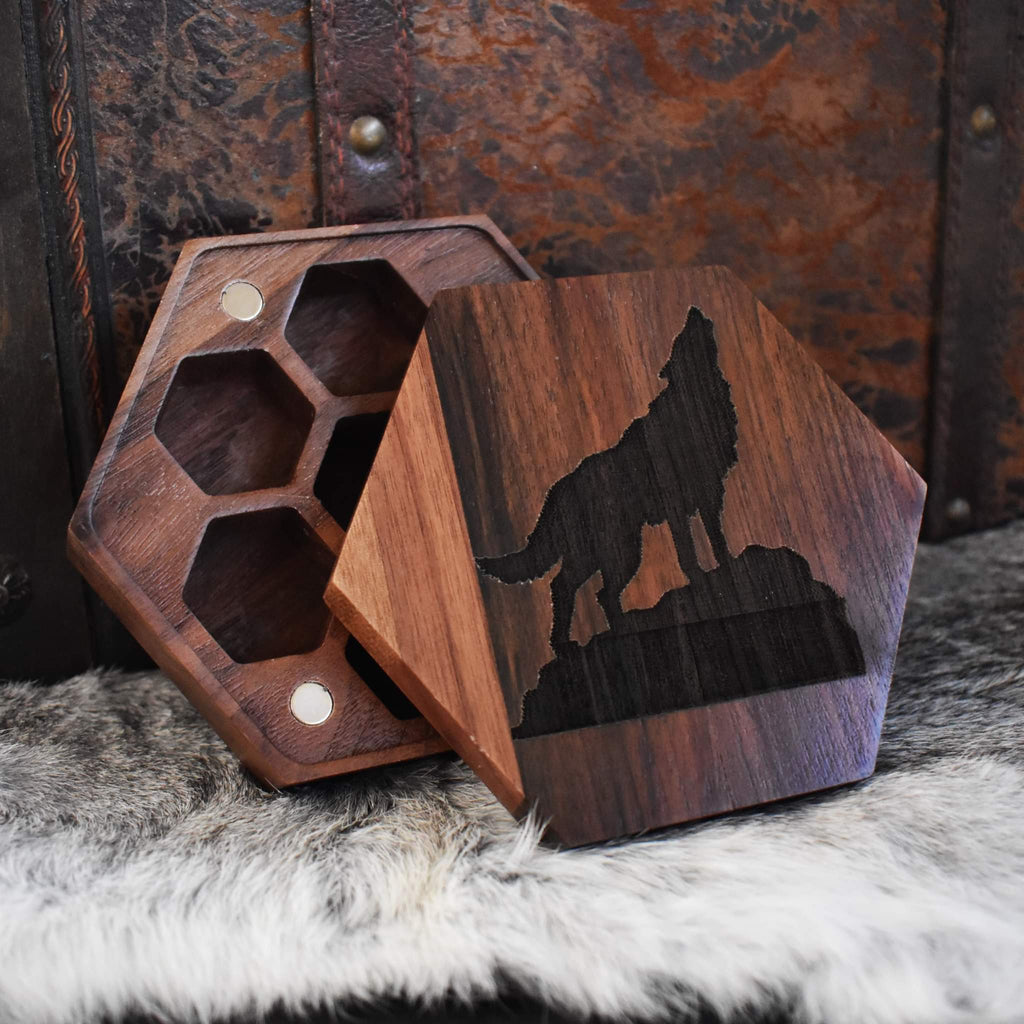 A wooden dice case featuring a wolf