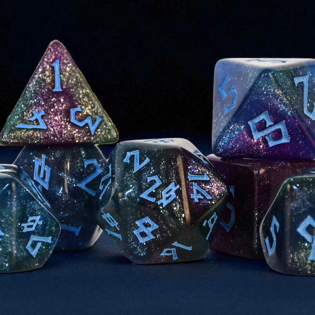 Set of glittery polyhedral dice with blue numbering on a dark background