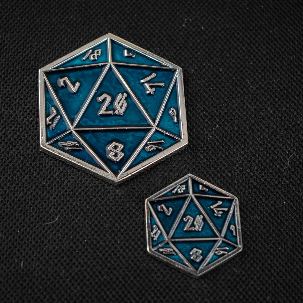 An aqua D20 pin with silver numbers in a Nordic font
