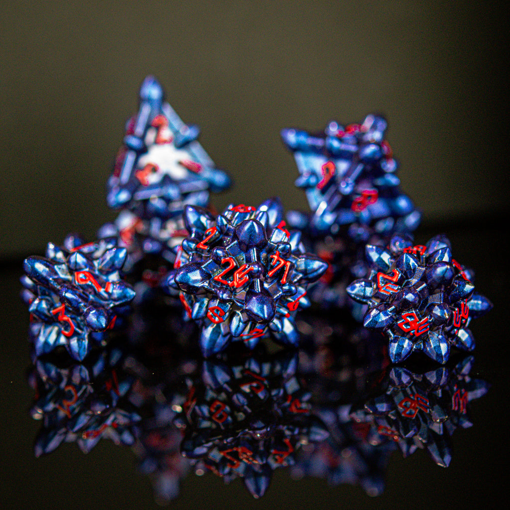 Spiky blue dice with red numbers in a Nordic font