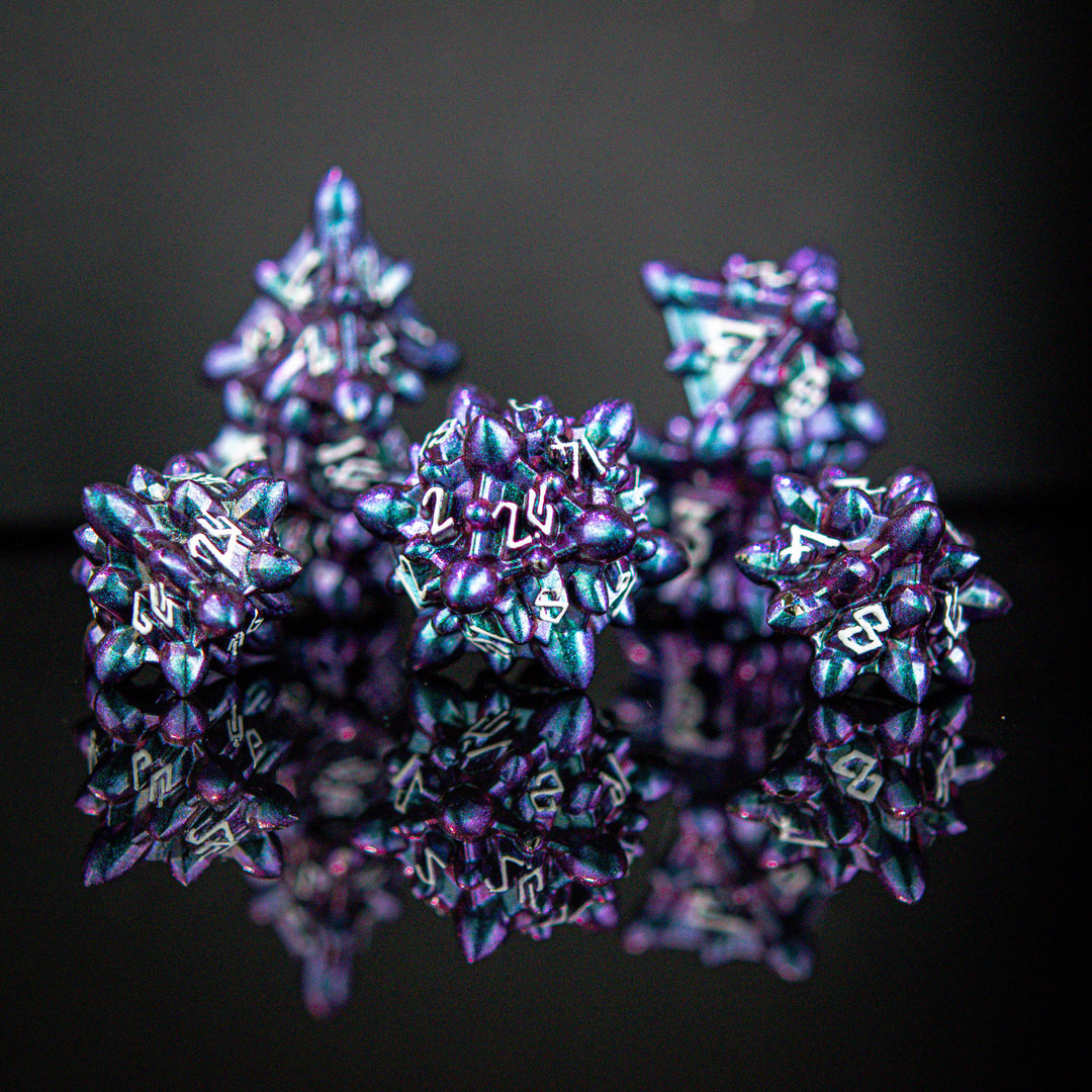 a purple and blue iridescent metal spiky asteroid like polyhedral dice set with white numbering