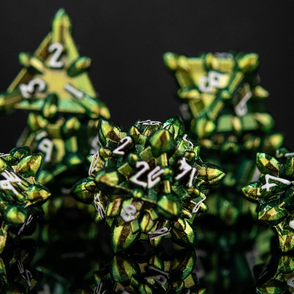 A set of green metal dice with embossed numbers, reflecting on a black surface, showcasing a unique extraterrestrial design.