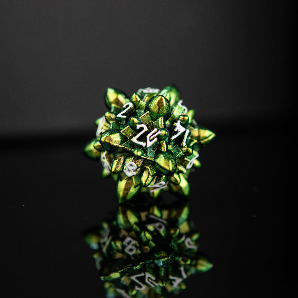A set of green metal dice with embossed numbers, reflecting on a black surface, showcasing a unique extraterrestrial design.
