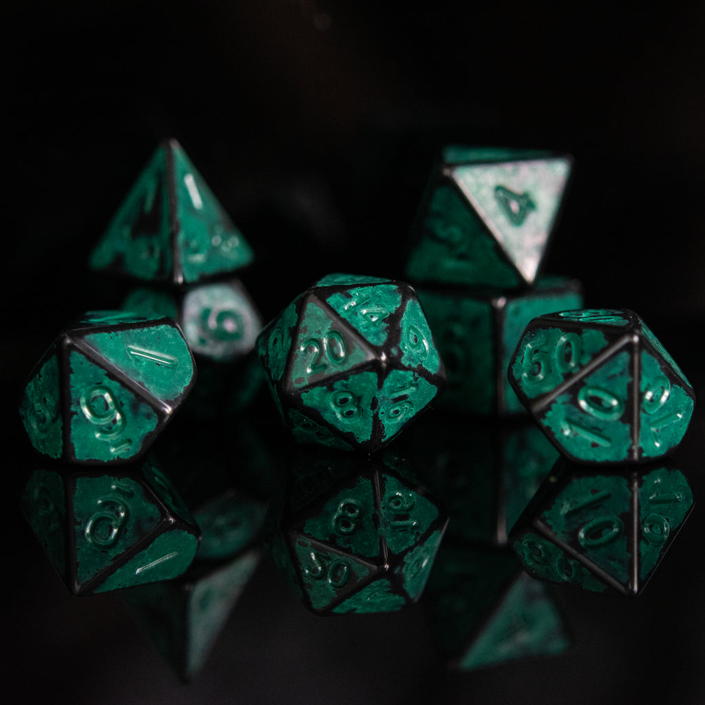Black acrylic dice with aqua green splashes and font