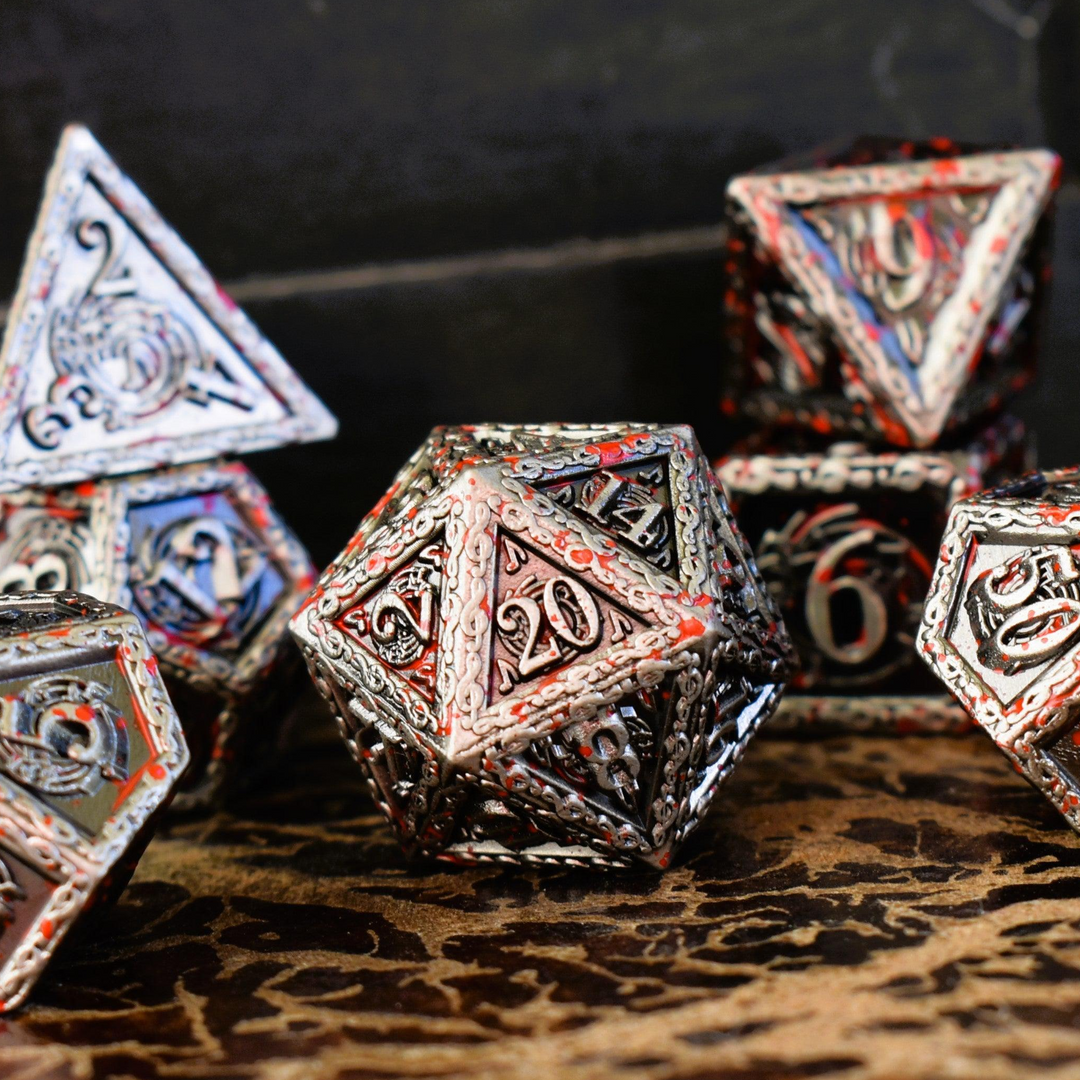 A set of silver metal dice with musical note details around the silver numbers splattered in red blood on a wooden surface, including various shapes such as a d4, d6, d8, d10, d12, and d20.
