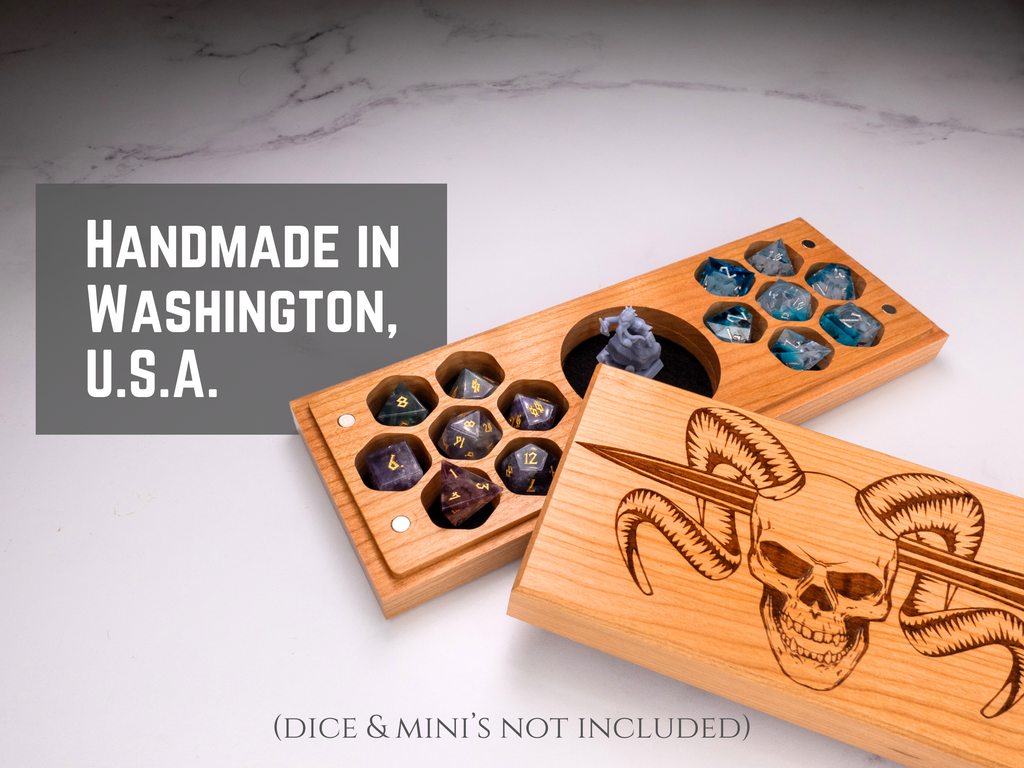 Wooden dice and miniatures box with engraved design on a marble surface, labeled 'Handmade in Washington, U.S.A.'