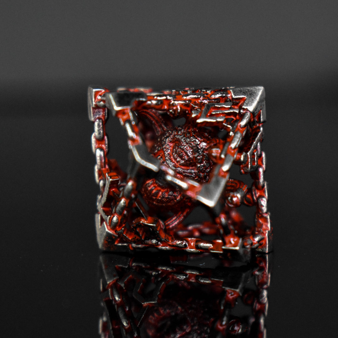 Silver and red hollow dice with beholders inside for tabletop gaming
