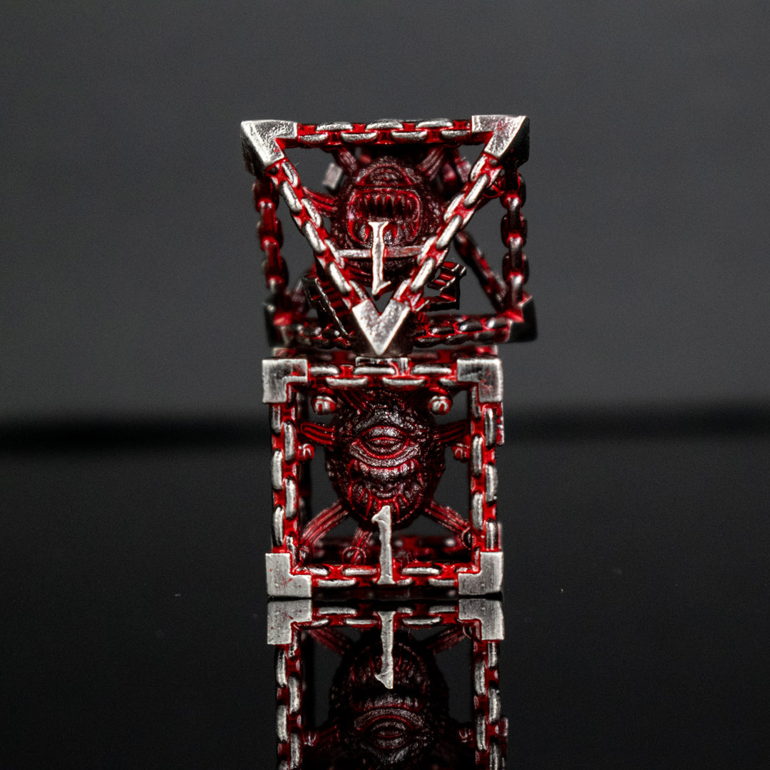 Silver and red hollow dice with beholders inside for tabletop gaming