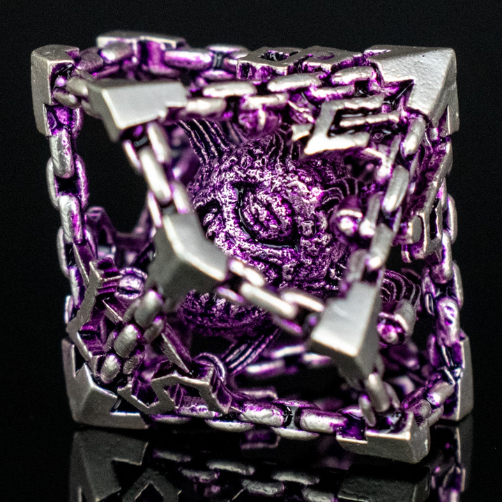 A set of hollow metal dice in purple and silver colors with embossed numbers and a beholder inside, reflecting on a shiny surface.
