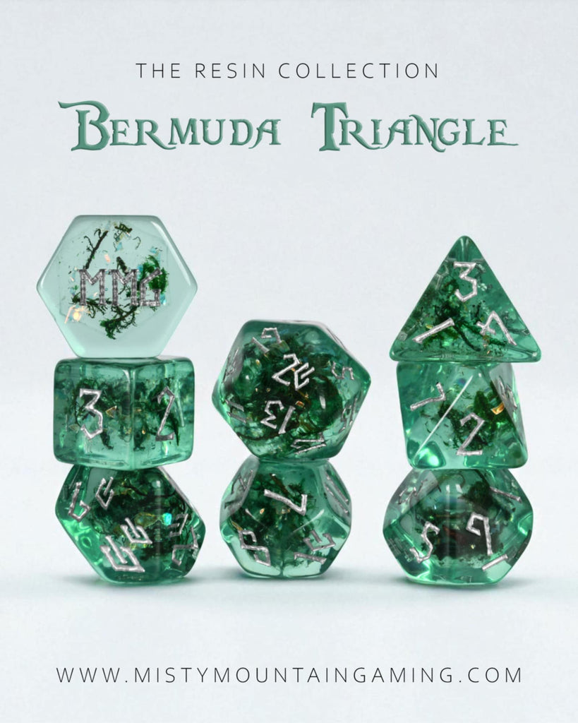 Set of green resin dice with 'Bermuda Triangle' text on a white background, featuring Misty Mountaining Gaming branding.