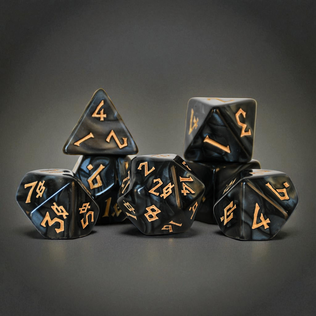 A set of marble like black acrylic dice with gold nordic numbering font for tabletop gaming