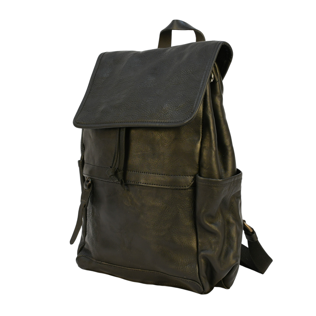 black modern rugged leather backpack on a wooden table with books and a globe in the background