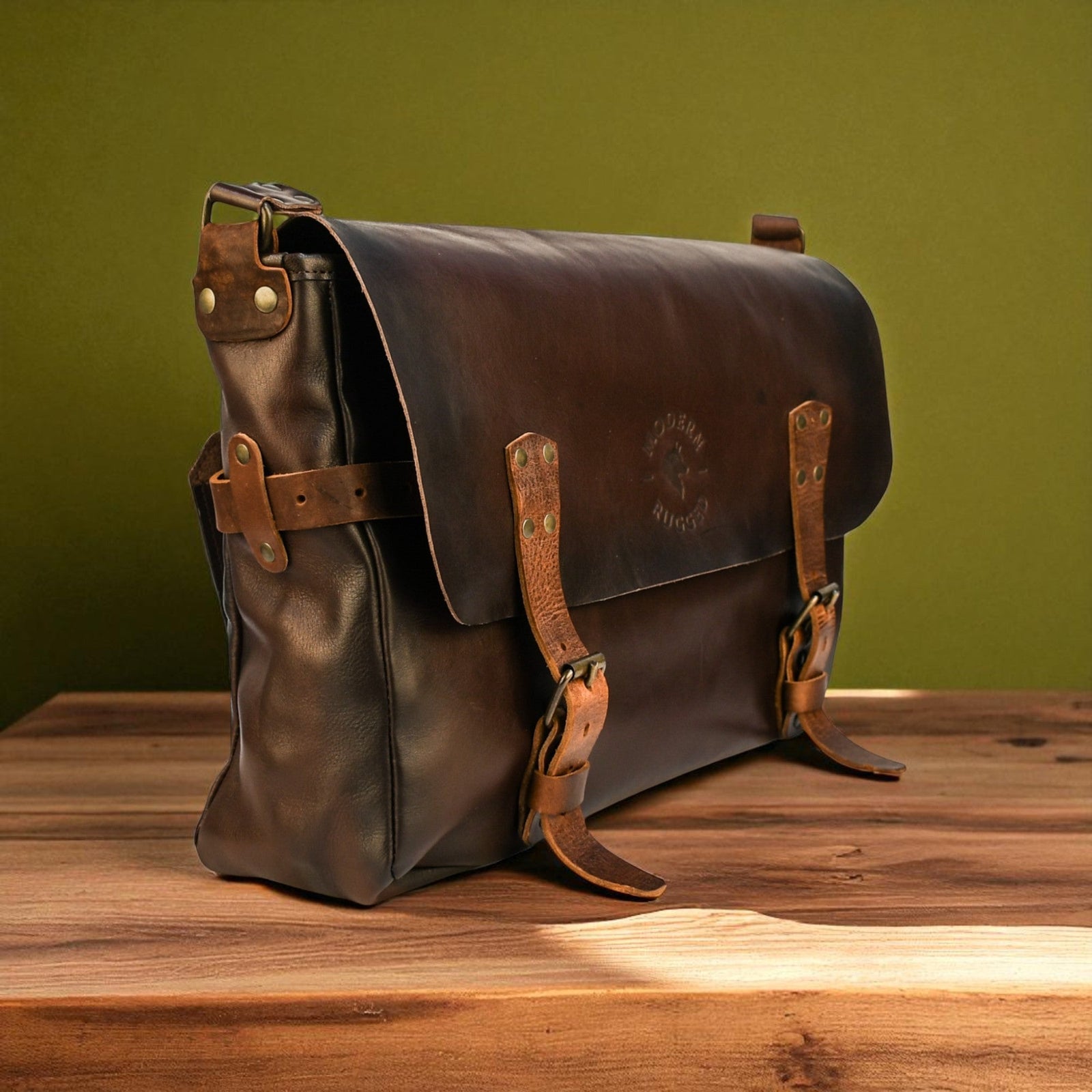 Brown leather satchel bag on a wooden surface with a green background