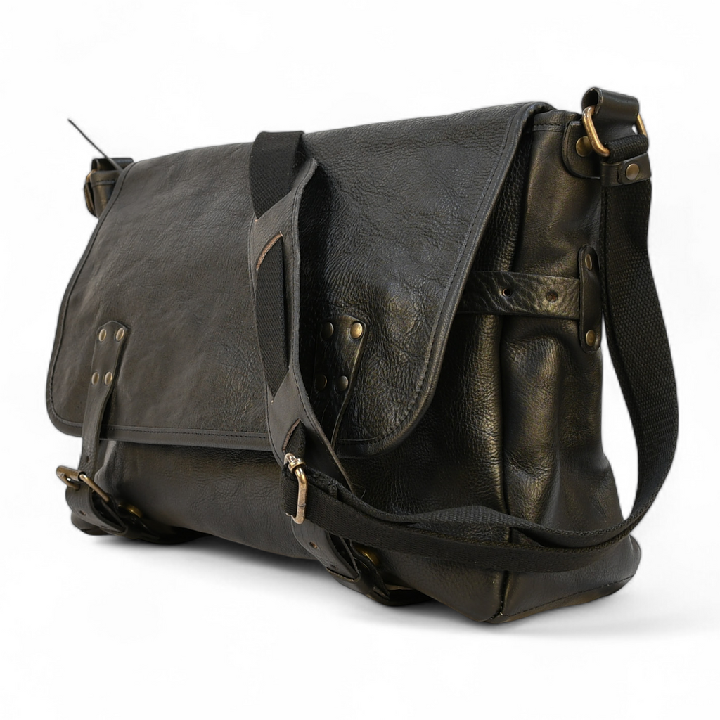 Black leather modern rugged messenger bag on a wooden surface