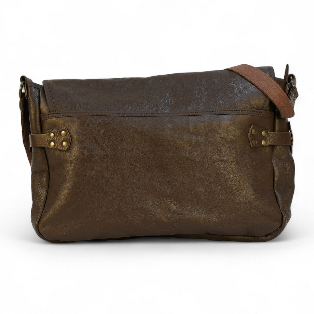 Brown leather bag with a strap on a white background