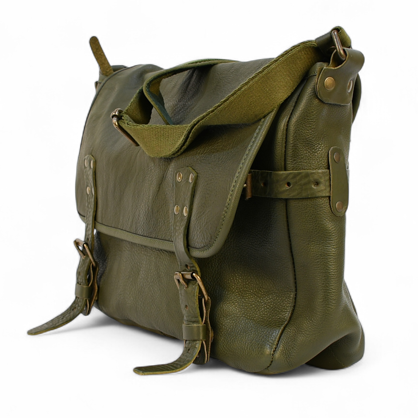 Green modern rugged messenger leather bag on a wooden surface with a vintage bookshelf background