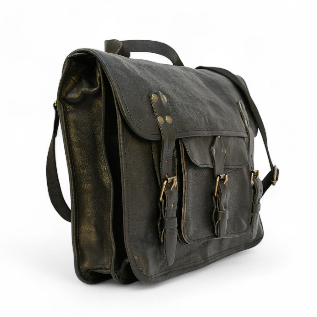 Vintage-style modern rugged leather briefcase bag on a wooden surface with bookshelf in the background