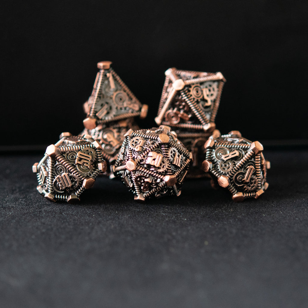 solid metal steampunk inspired dnd polyhedral dicce in bronze with green accents around the gears and numbers