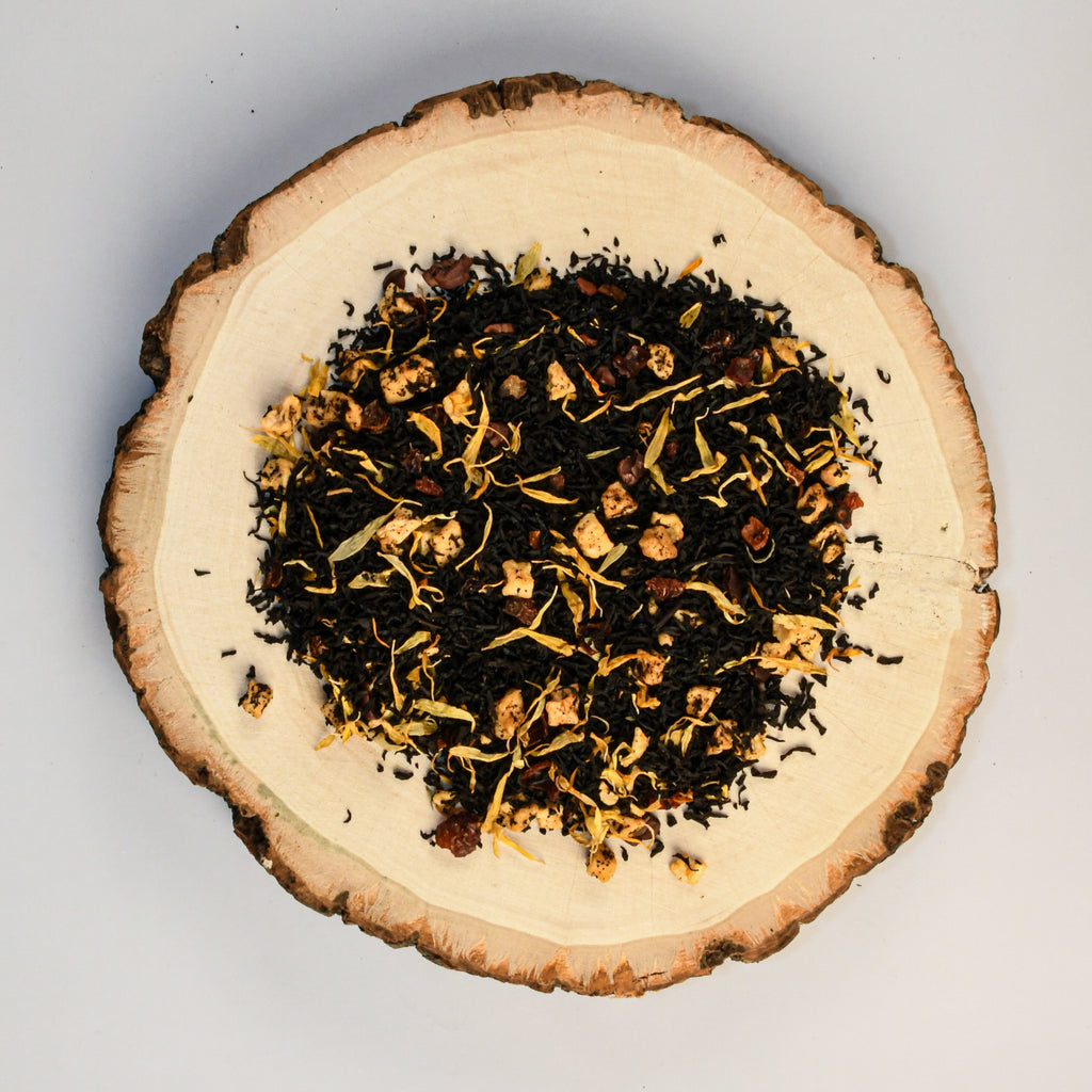 loose misty mountain gaming tea leaves on a tree stump