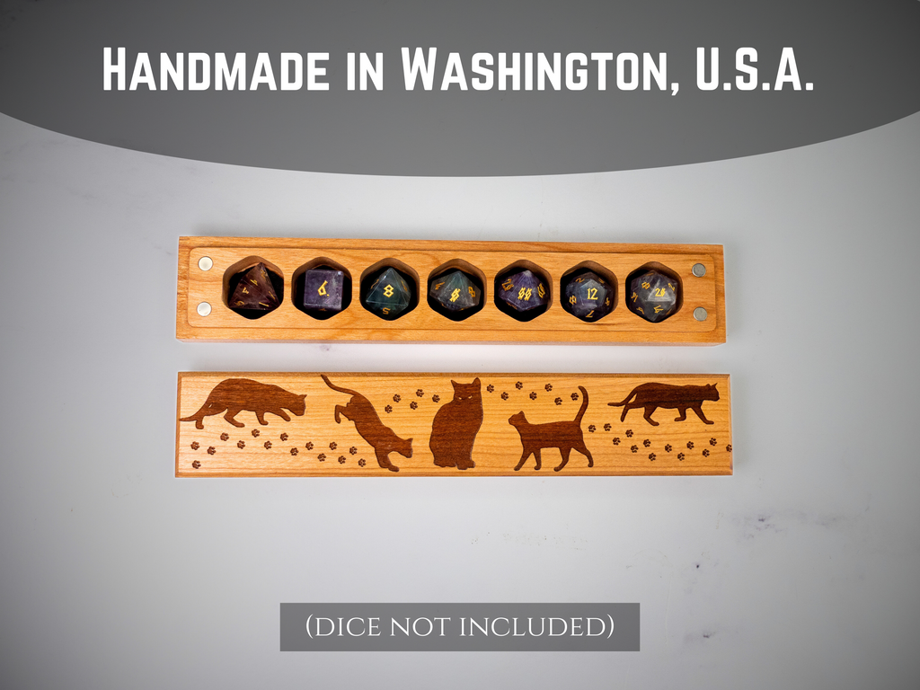 Wooden dice tray with engraved animal designs on a gray background, labeled 'Handmade in Washington, U.S.A.'