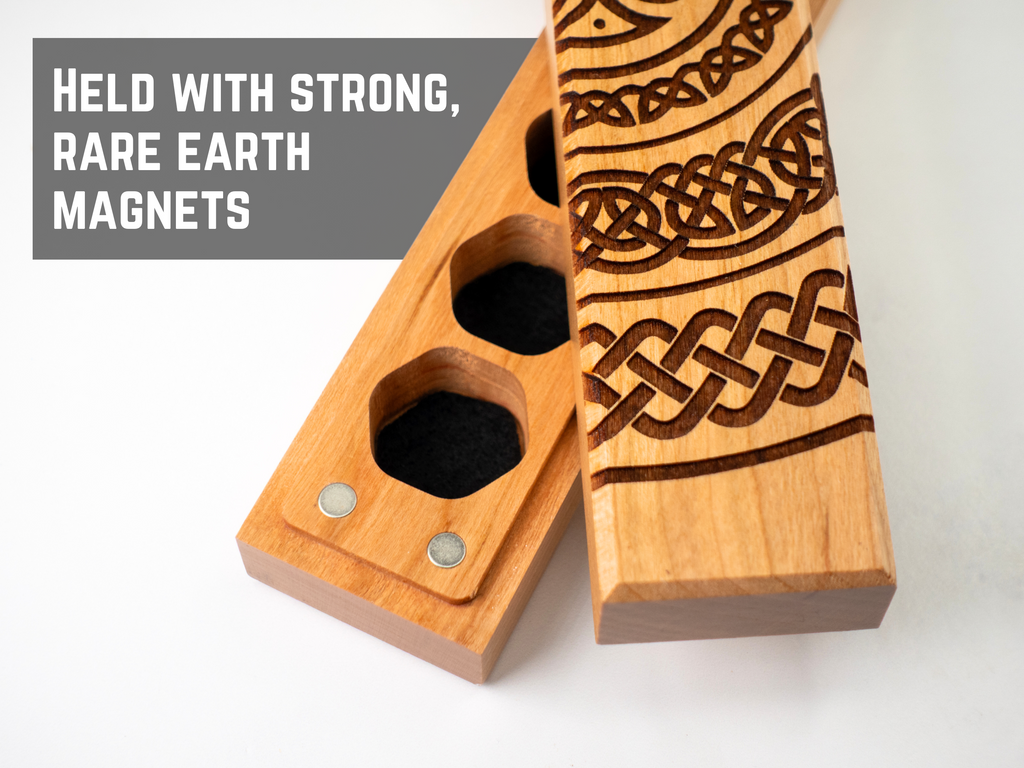 Wooden magnetic dice storage box with Celtic knot design on a white background