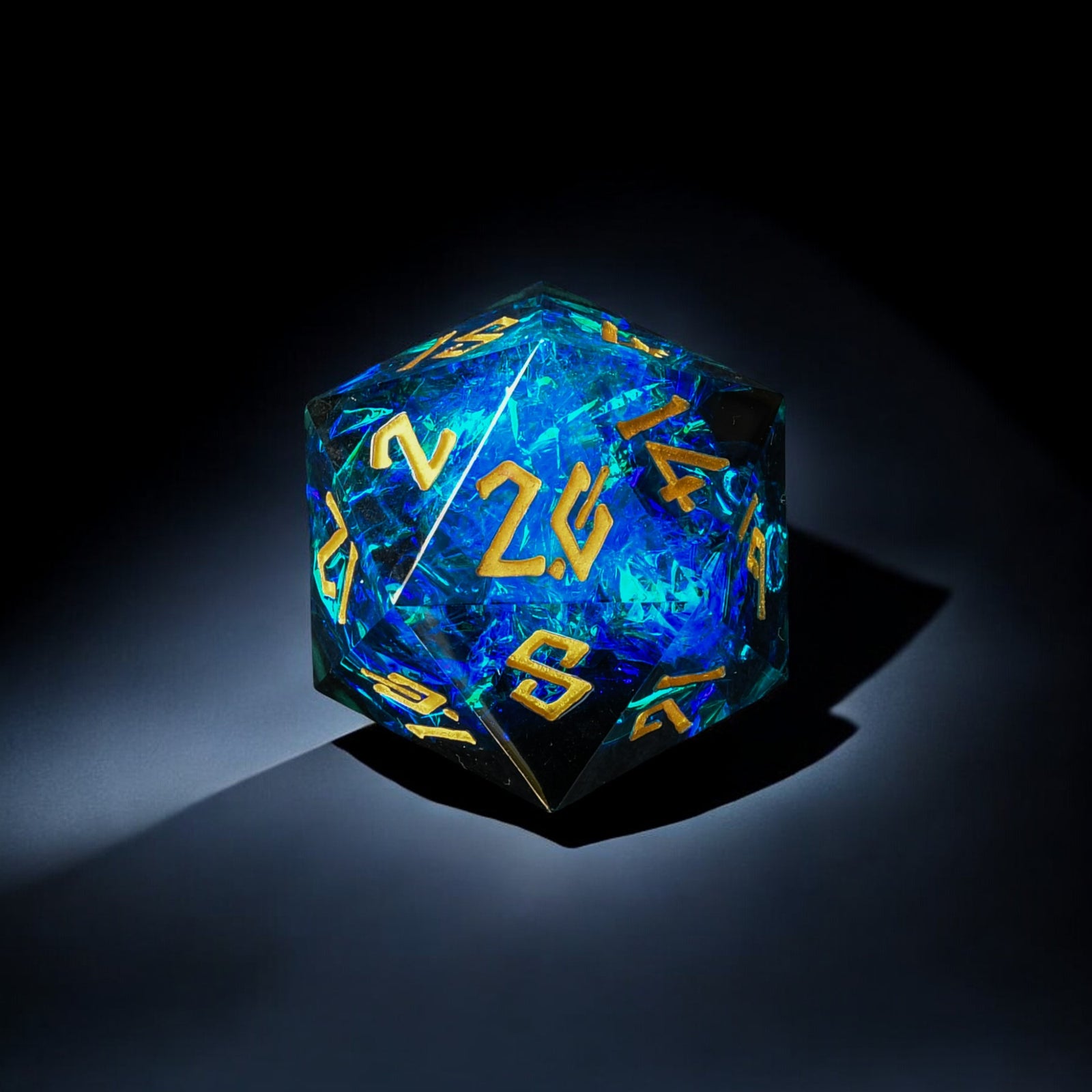 A hand-crafted, sharp-edged resin dice with hand-painted numbers, predominantly blue in color, used for tabletop RPG games.