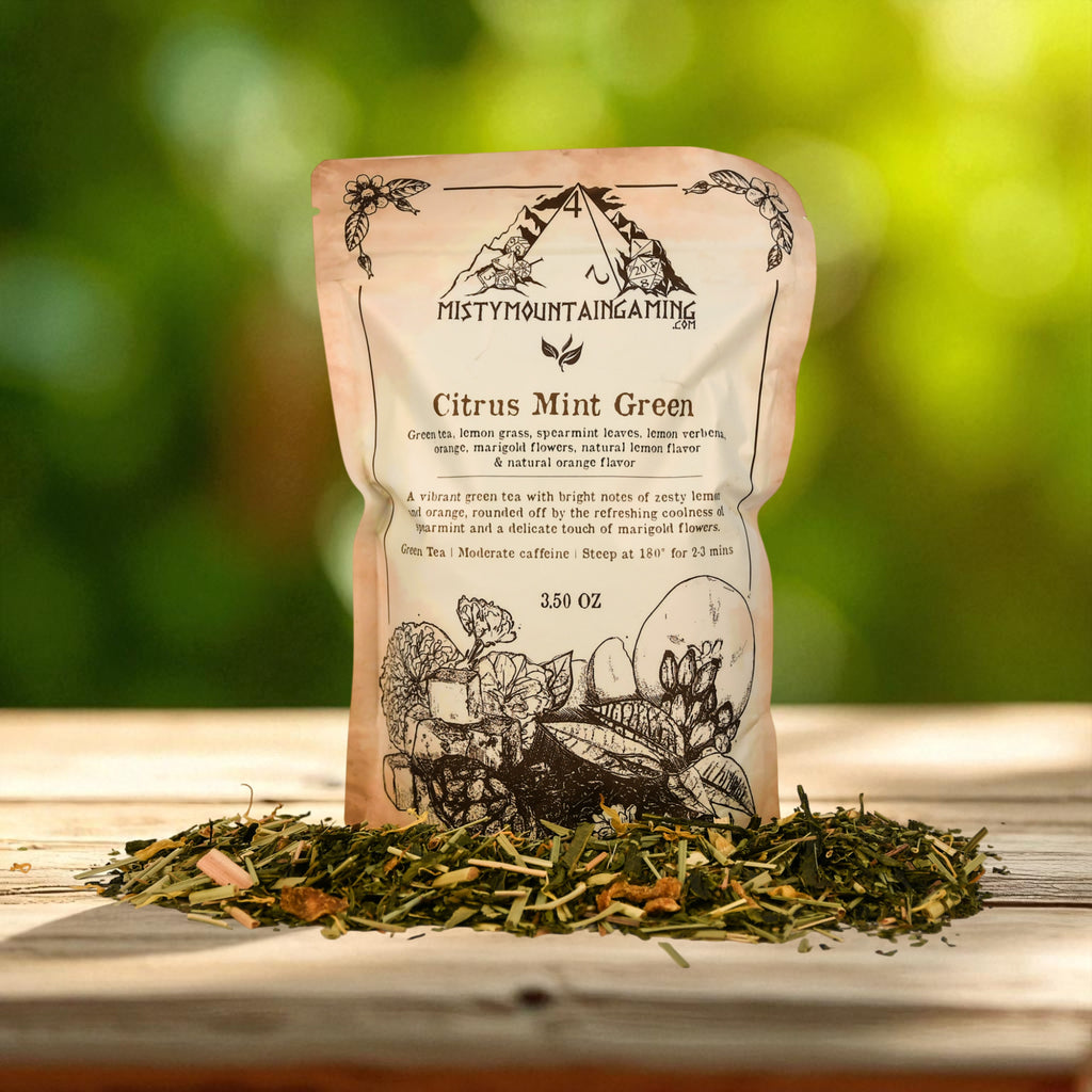 Tea package labeled 'Citrus Mint Green' with loose tea leaves on a wooden surface