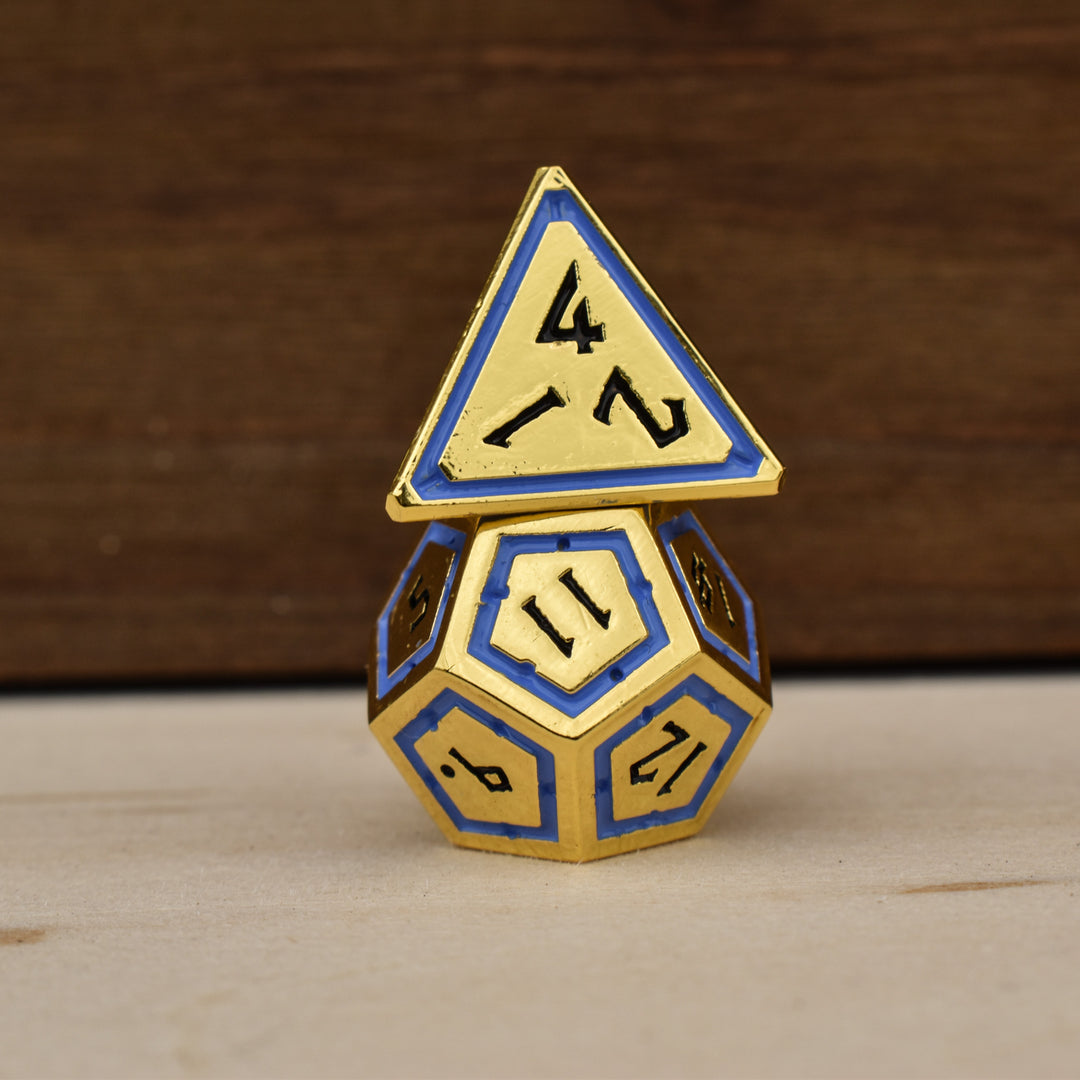 gold polyhedral dnd dice with blue borders on each face and black numbering