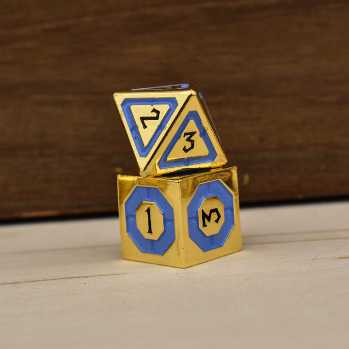 gold polyhedral dnd dice with blue borders on each face and black numbering