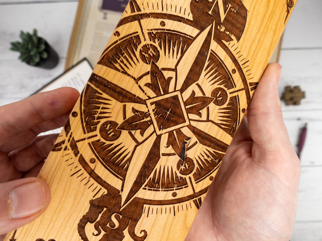 wood dice vault with a compass engraved for tabletop gaming