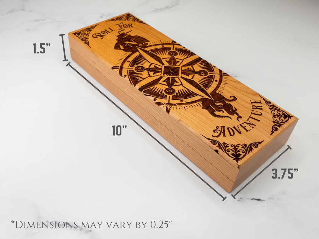 Wooden dice vault with compass design and engraved text on a white background