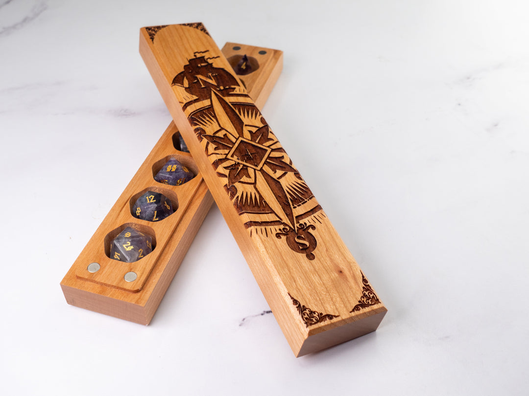 Wooden dice tray with engraved design on a white background
