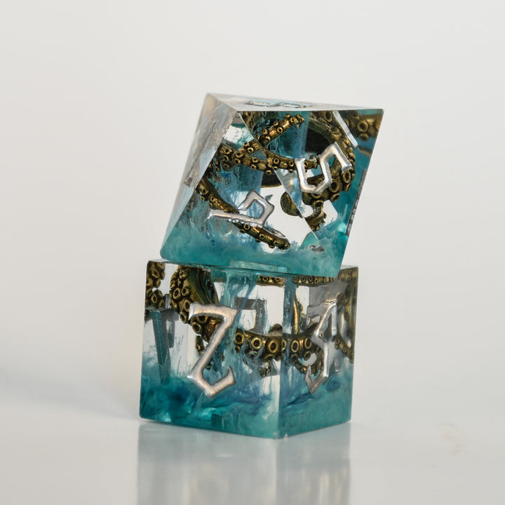 blue sharp edge resin dnd sice with bronze cthulhu tentacles insides and white numbering