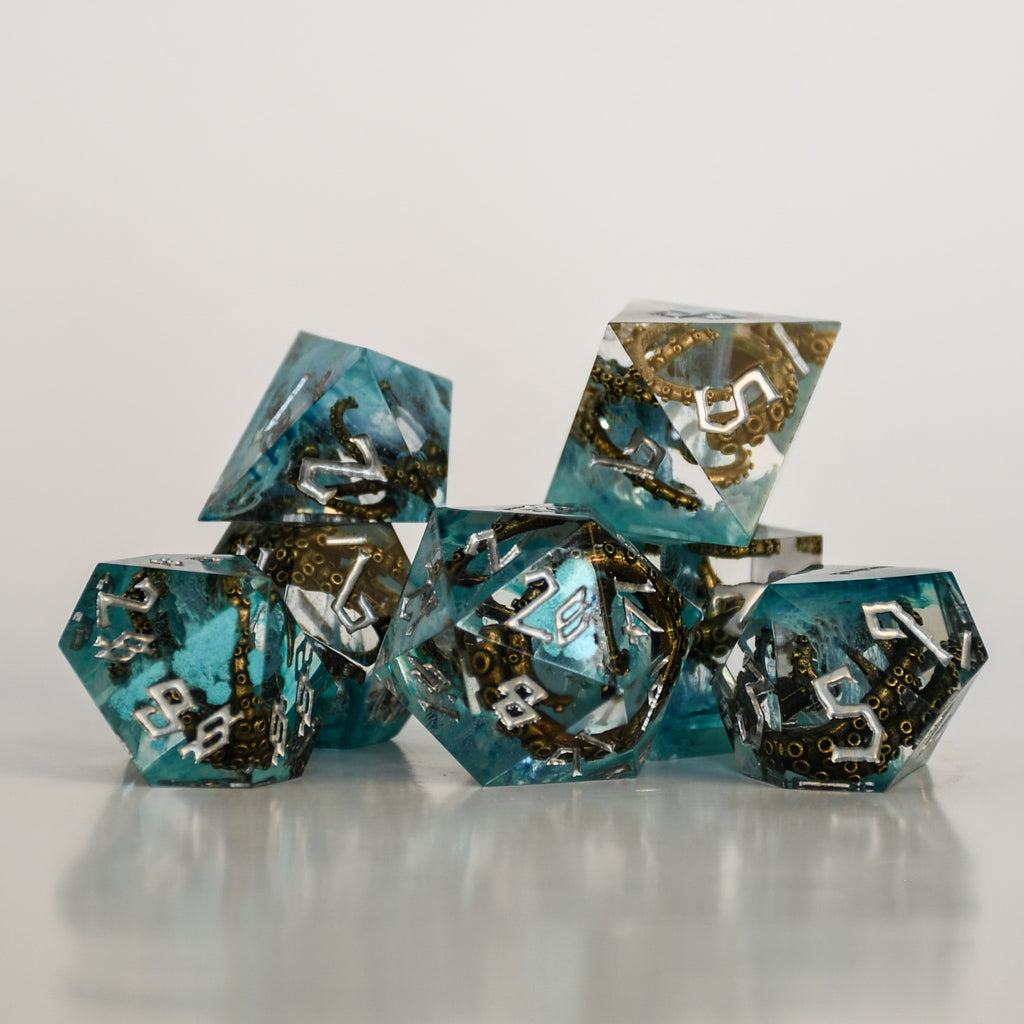 blue sharp edge resin dnd sice with bronze cthulhu tentacles insides and white numbering