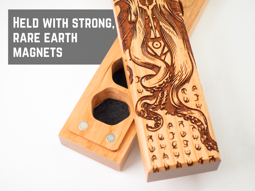 Wooden magnetic dice vault with intricate design on a white background, featuring text about magnets.