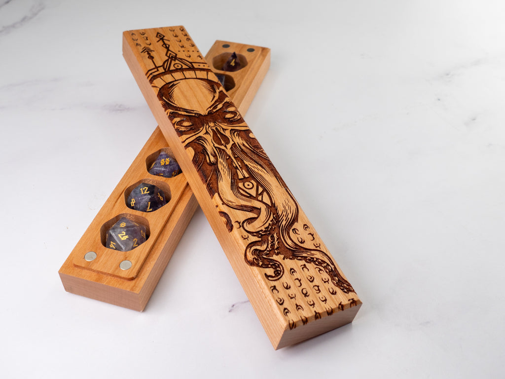 Wooden dice tray with engraved design on a white background