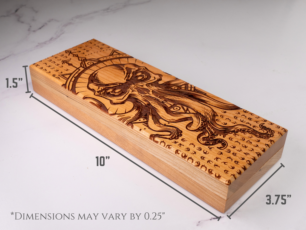 Wooden dice vault with engraved design on a marble surface