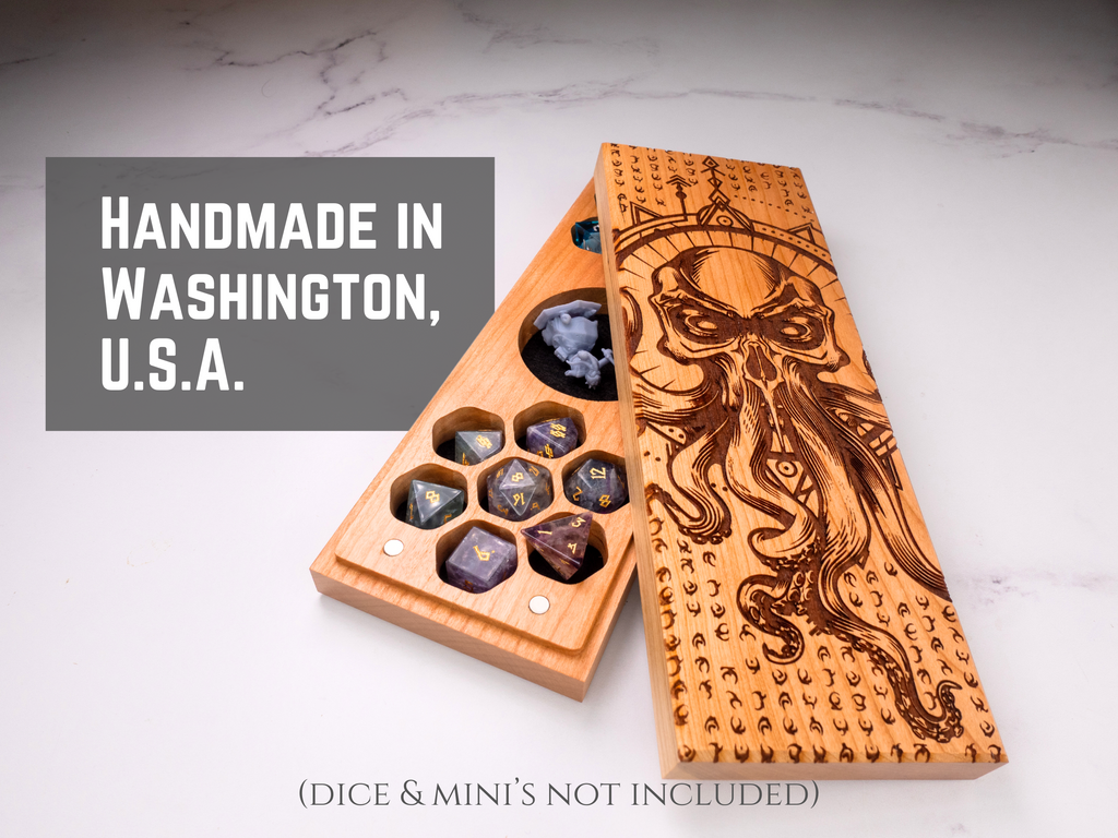 Wooden dice tray with engraved design on a marble surface, labeled 'Handmade in Washington, U.S.A.'