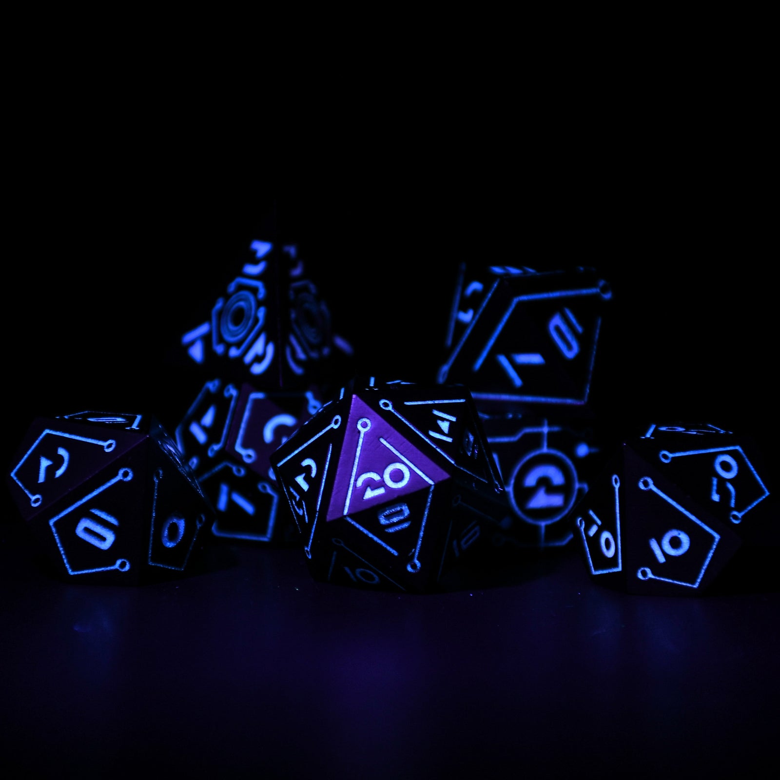 Glowing blue polyhedral dice set on a black background