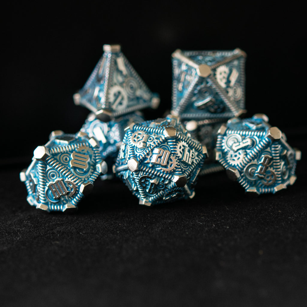 Silver and blue metal dice with gears on all sides
