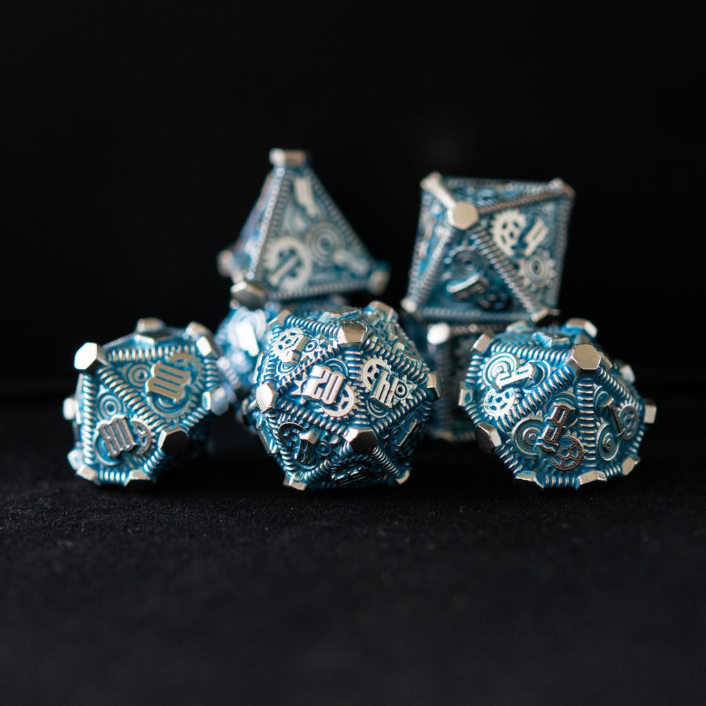 Silver and blue metal dice with gears on all sides