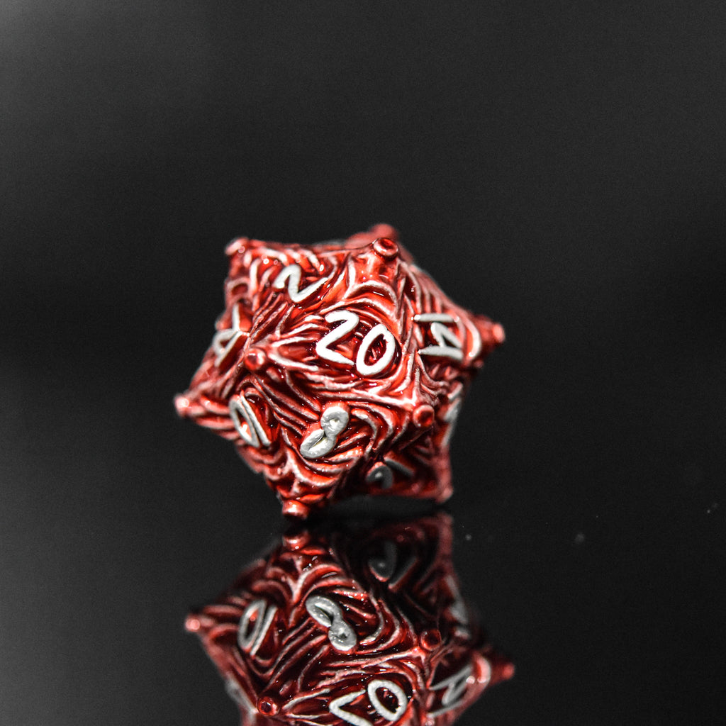 Red metal vortex D20 featuring silver font numbers