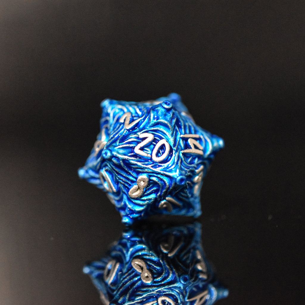 Blue metal D20 with vortex swirls and a silver font