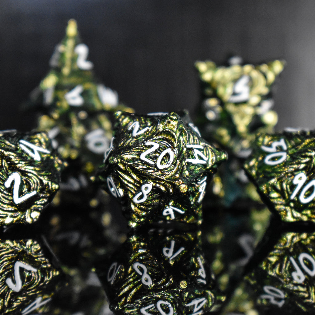 Green pearlescent metal dice with white font numbers