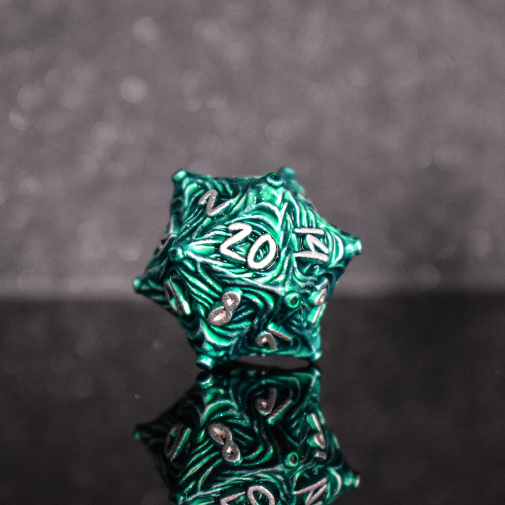 Green metal D20 with vortex swirls and a white font